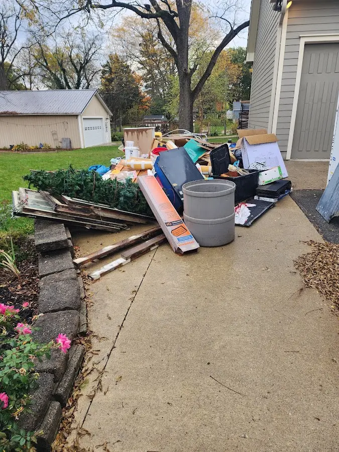 Dumpster being loaded with debris for Commercial Dumpster Rental in Hitchcock